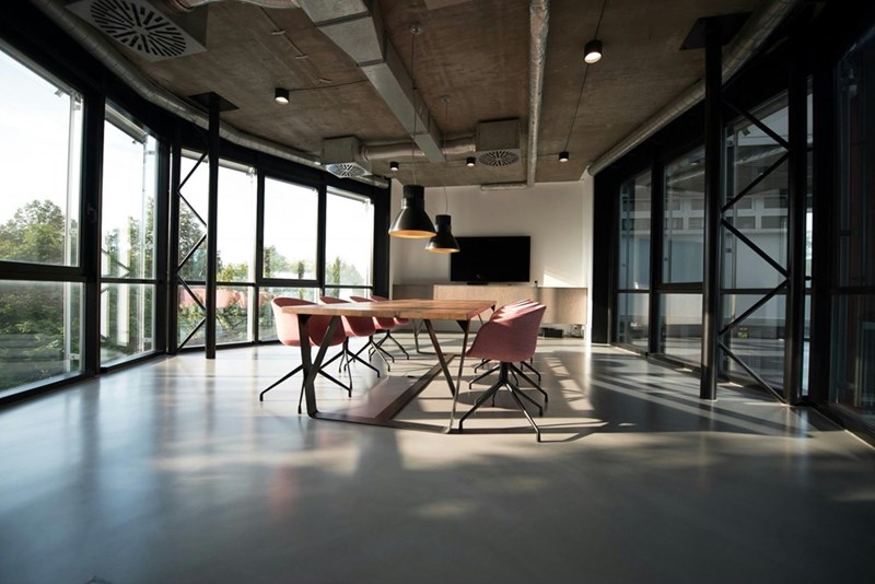Empty workspace displaying chairs in a large conference room.