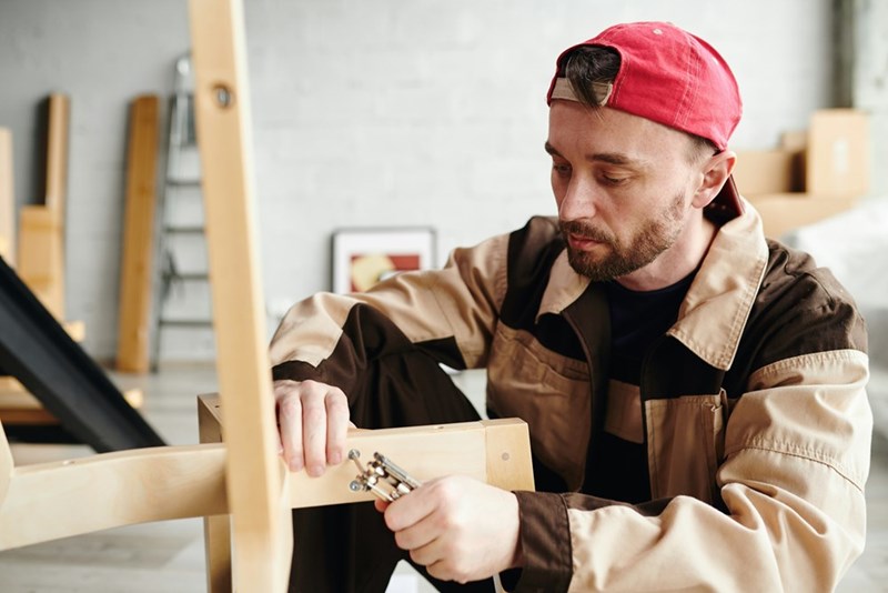 Upholsterer making a chair