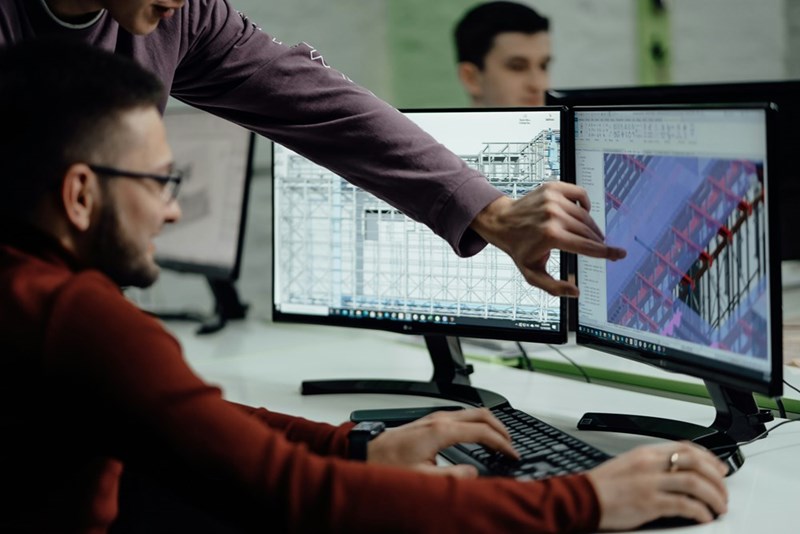 Construction engineer building Revit models at the office.