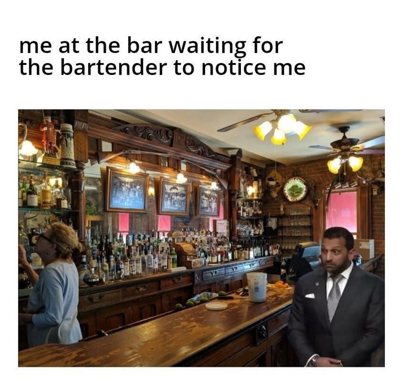 me at the bar waiting for the bartender to notice me