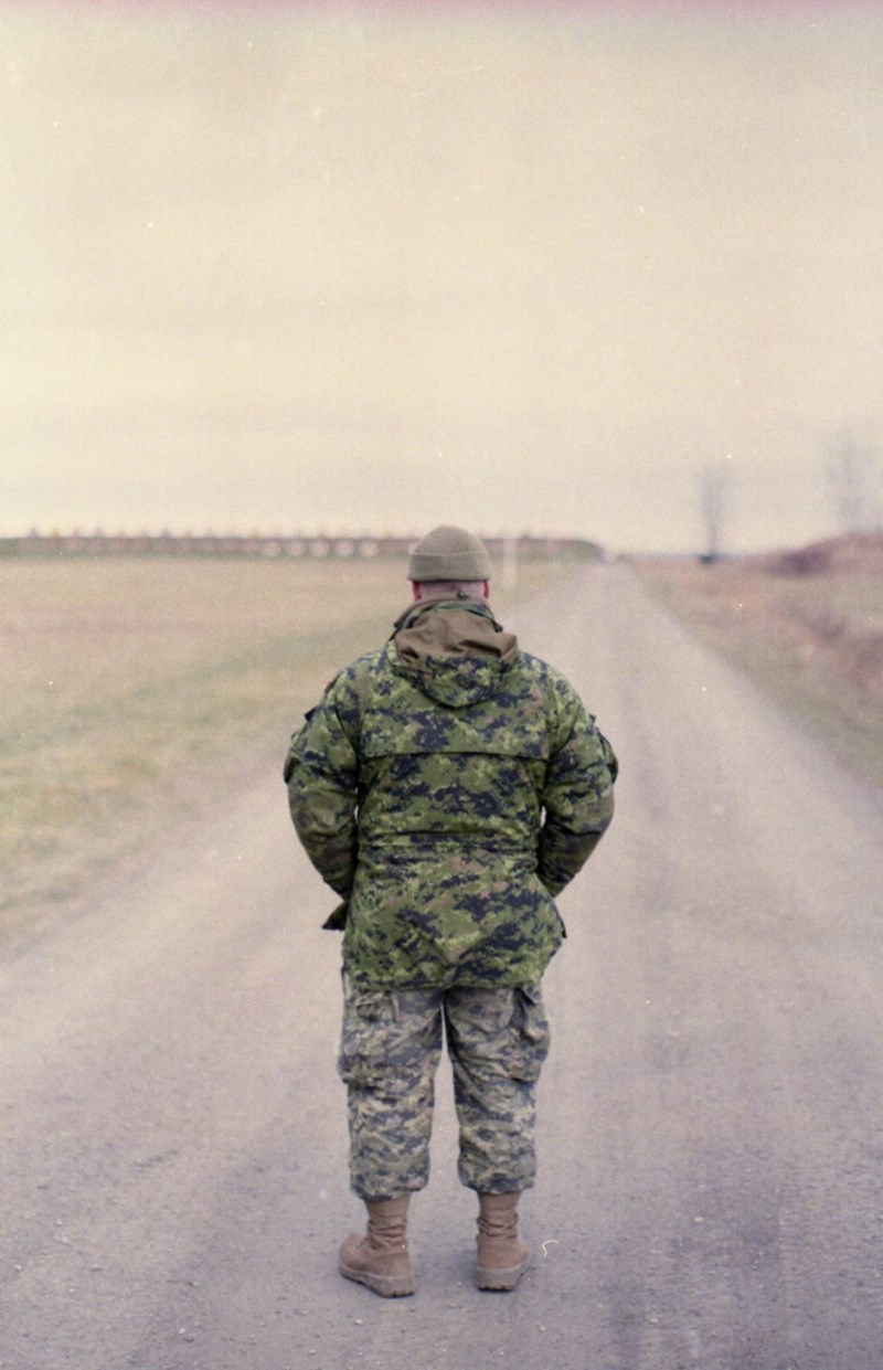 USA Army vet walks down a dusty road on his way home