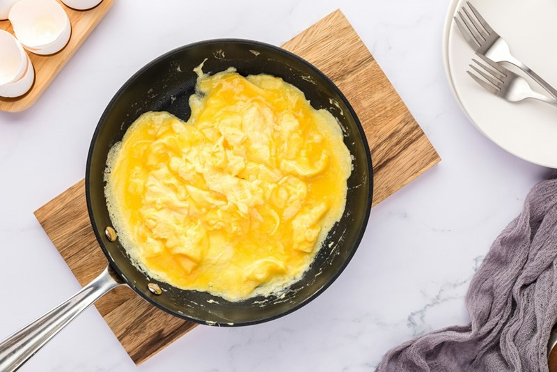 A pan filled with eggs on top of a table