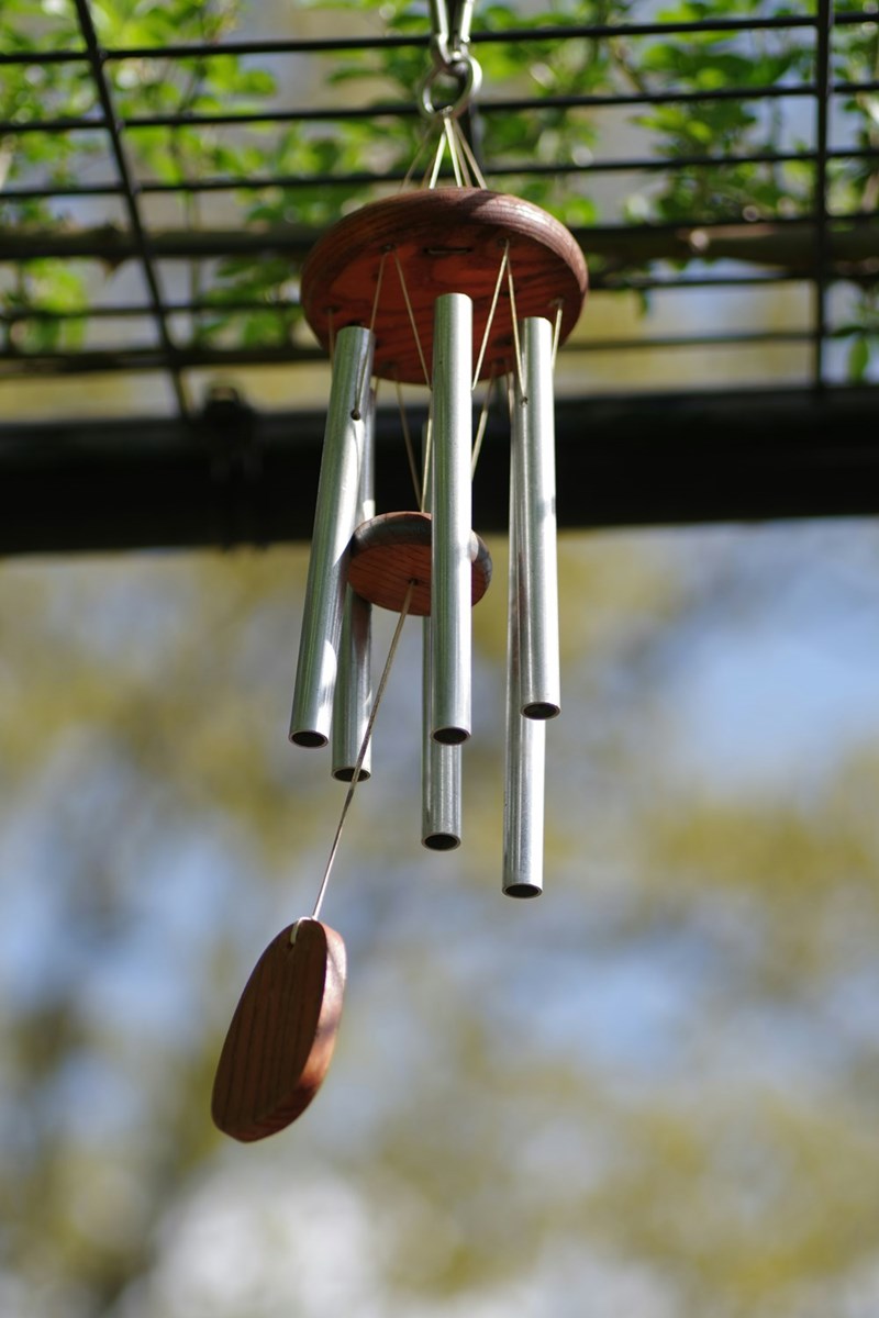 A wind chime hanging outside.