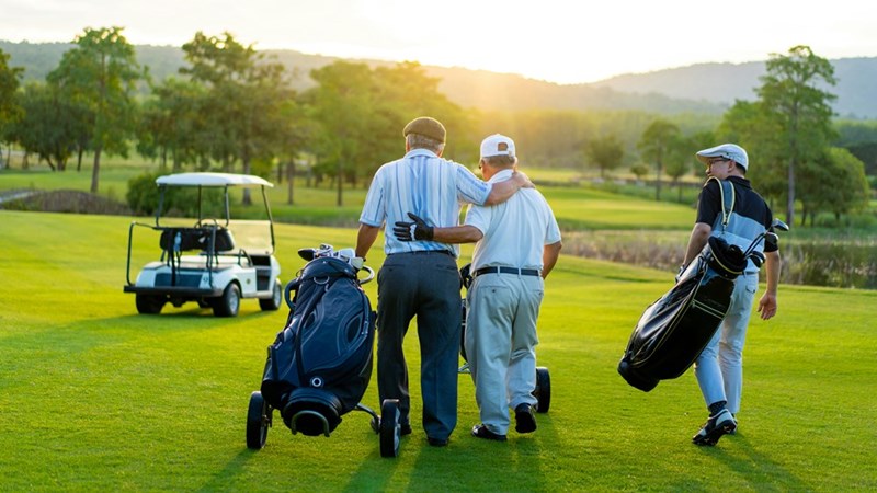 Golfers embrace after having a tough time on the golf course.