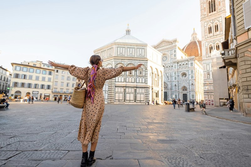 Woman enjoys beautiful view on famous Duomo cathedral in Florence