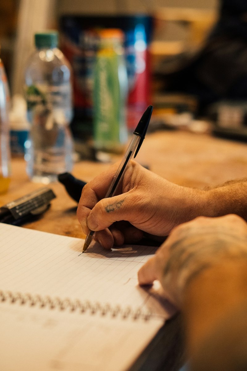 Man writing on a piece of paper