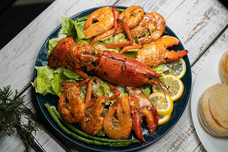 Lobster and shrimp are served on a plate
