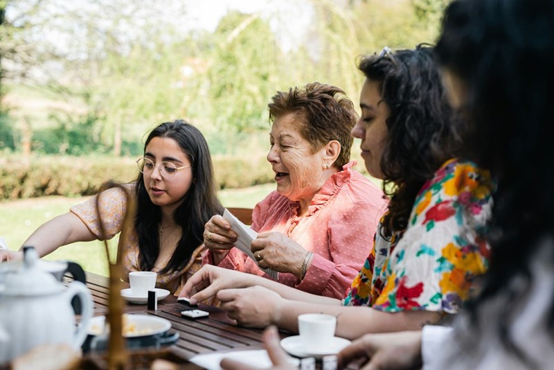 Multiple generations of a family spend time together.