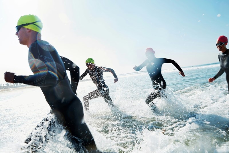 A group of athletes competing in a triathlon