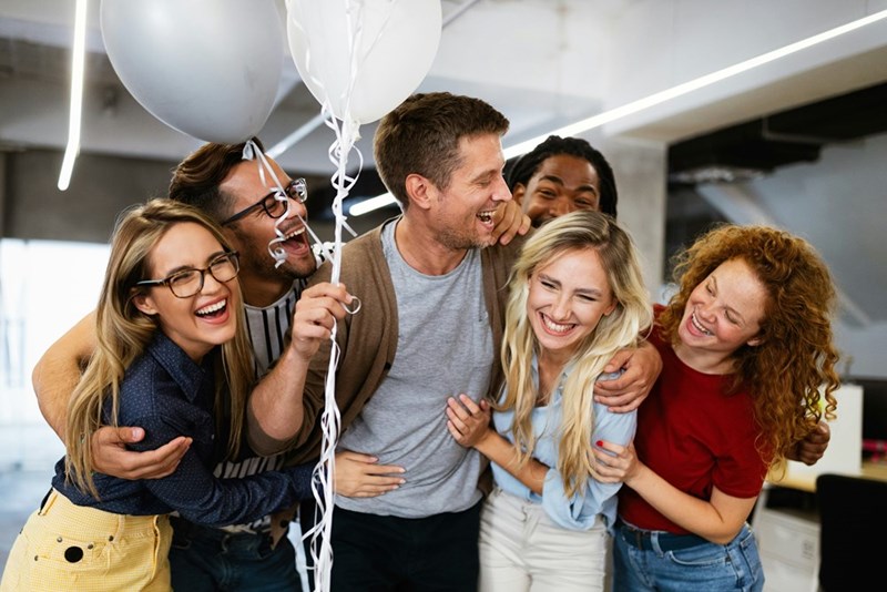 A team celebrates together in the office