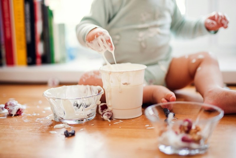 A toddler turns snack time into total chaos.