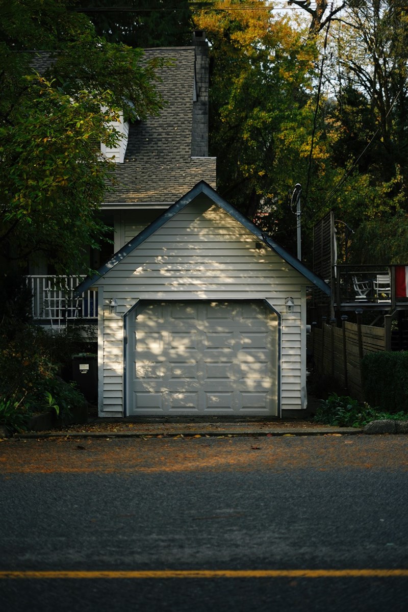An attached car port to a house.