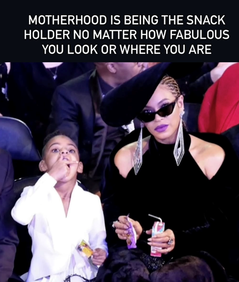 MOTHERHOOD IS BEING THE SNACK HOLDER NO MATTER HOW FABULOUS YOU LOOK OR WHERE YOU ARE