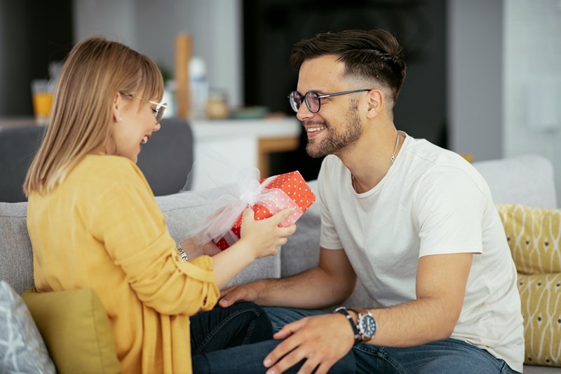 A man surprises his wife with a gift