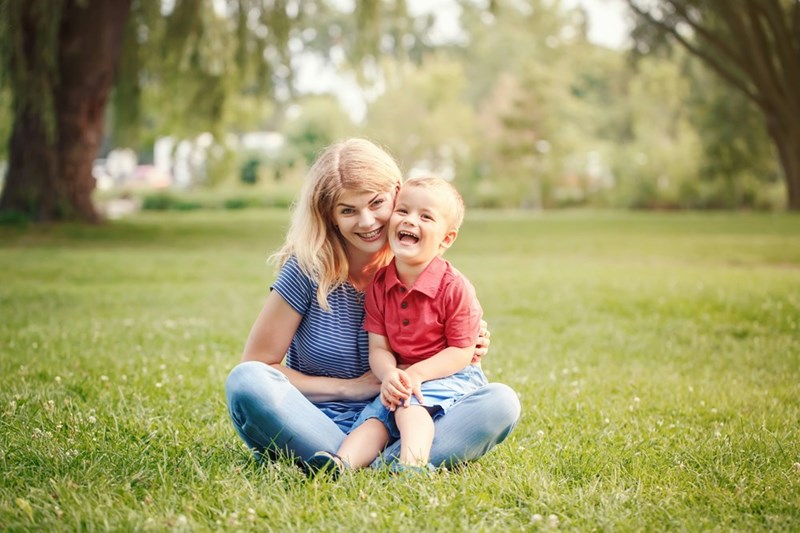 Mom hugs son close.