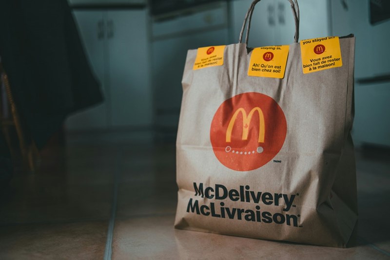 A McDonald's food order sits on the floor.