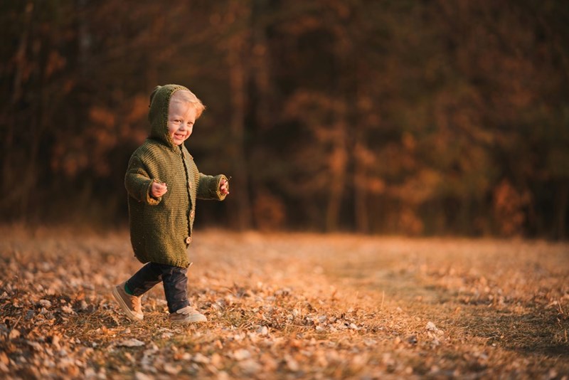 Child plays in nature.