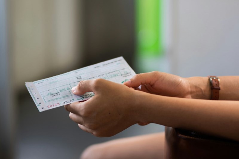 Person holding paper tickets