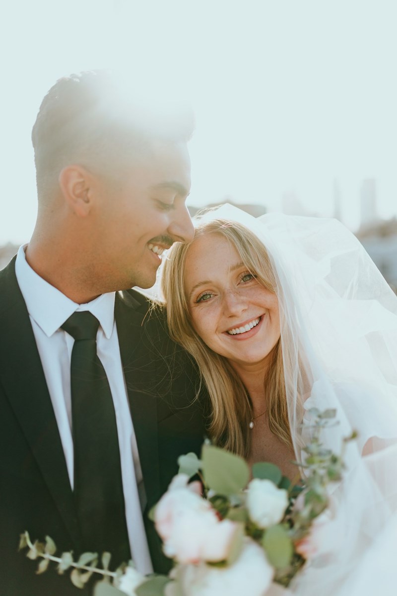 Smiling bride and groom.