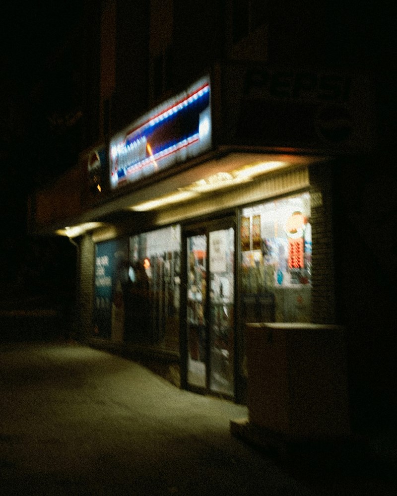 A convenience store lit ambiently at night