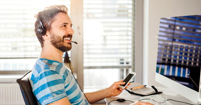 https://unsplash.com/photos/man-sitting-at-the-desk-working-from-home-on-computer-holding-a-smart-phone-wearing-headseat-PU5vl6xepY0
