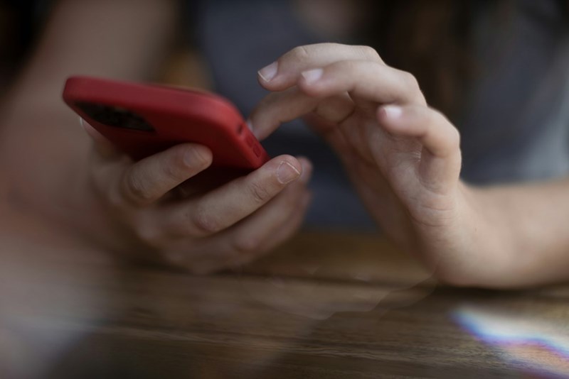 Woman types text messages back and forth with her MIL.