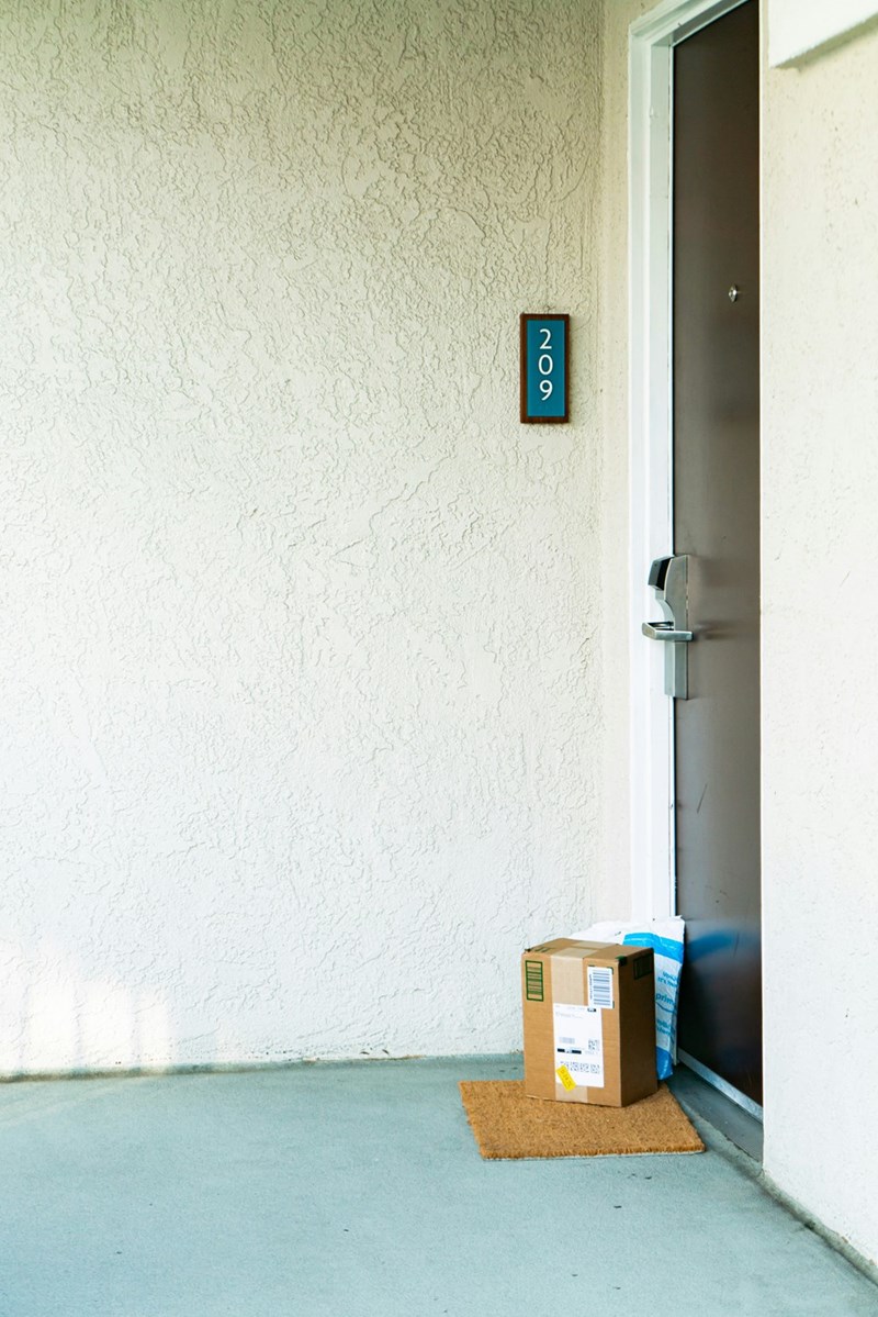 A package delivered at the wrong door entrance. 