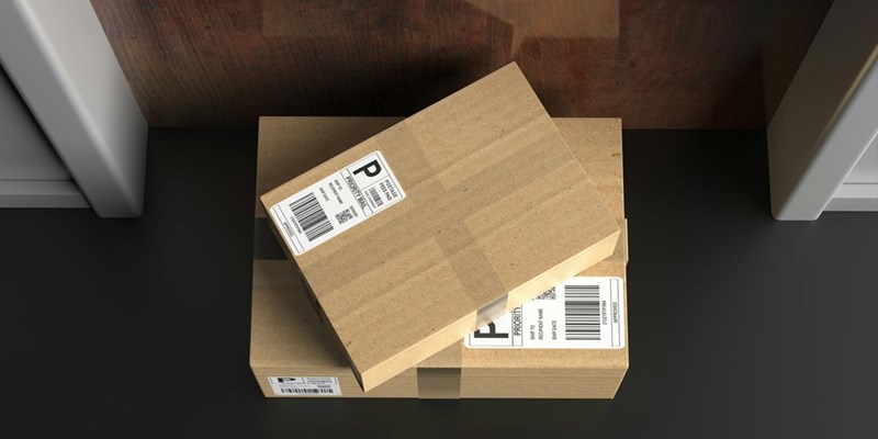 Packages recently delivered, waiting for someone to bring them inside.