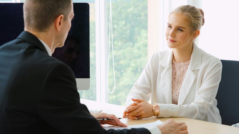 Job seeker in job interview meeting with manager and interviewer at corporate office