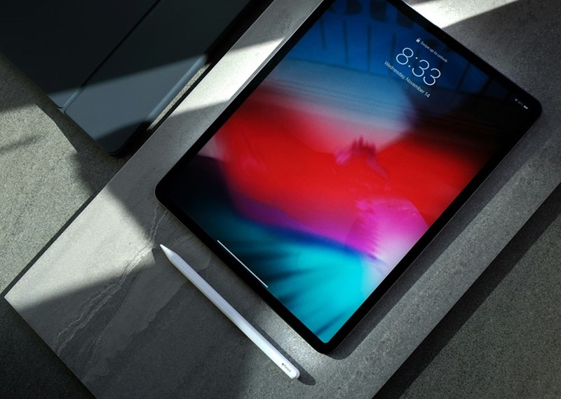 Black iPad with white stylus pen