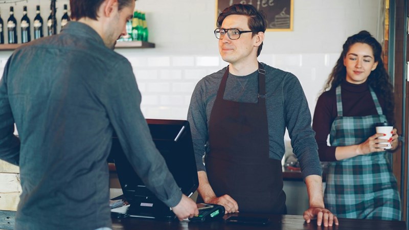 Cashier tries to talk to customer patiently.