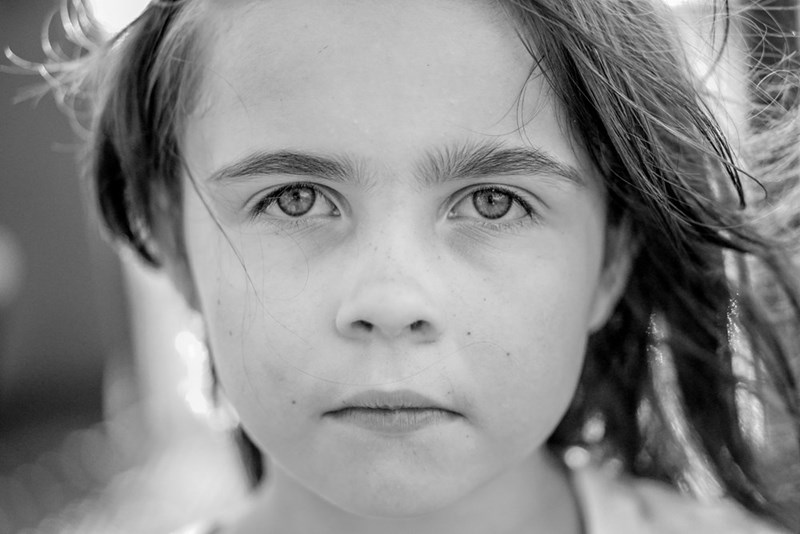 Grayscale photo of a girls face