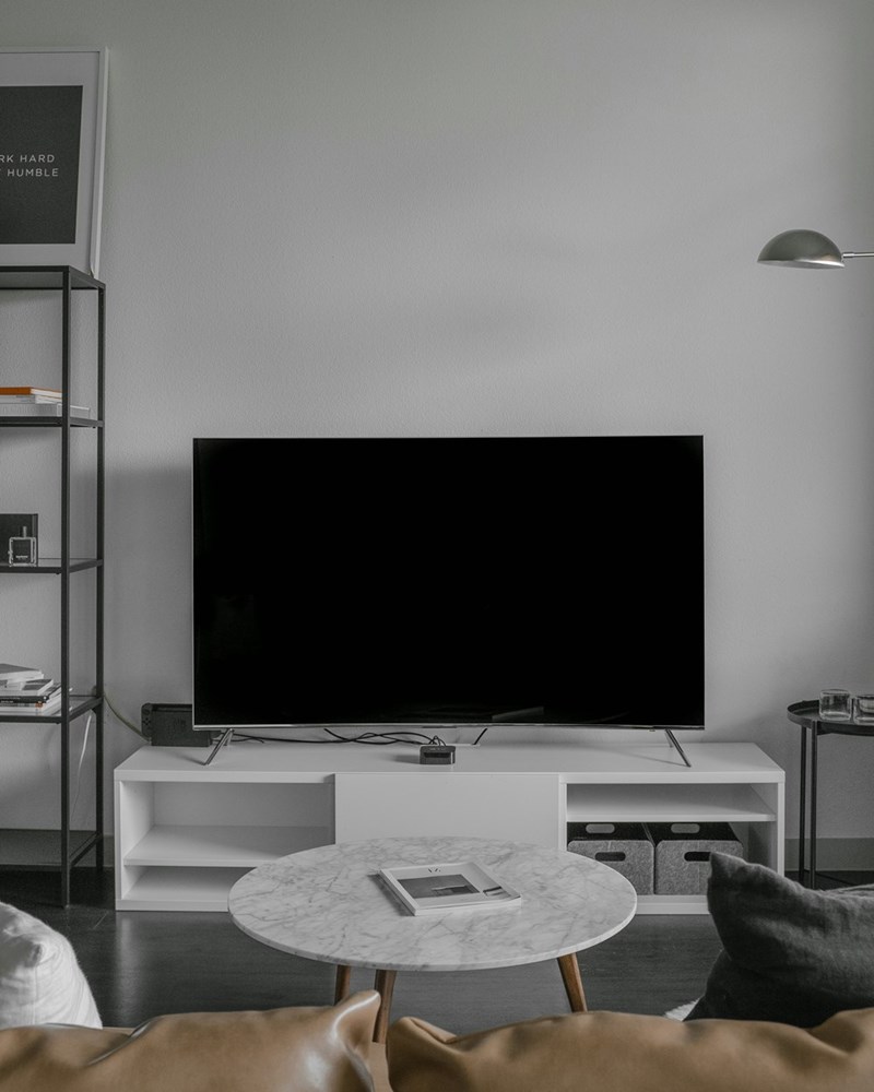 Flat screen TV displaying black screen