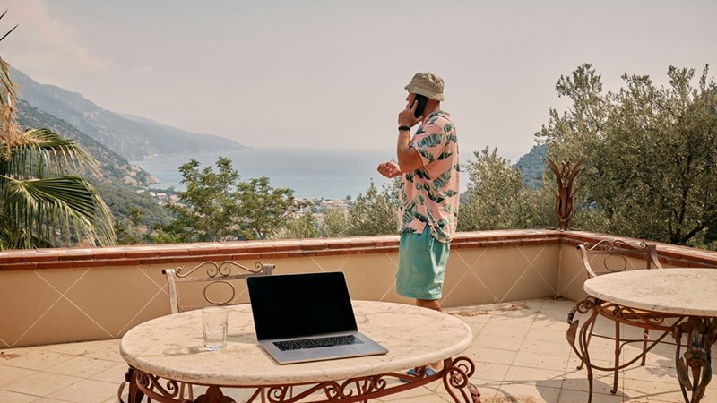 Remote worker takes a phone call outdoors.