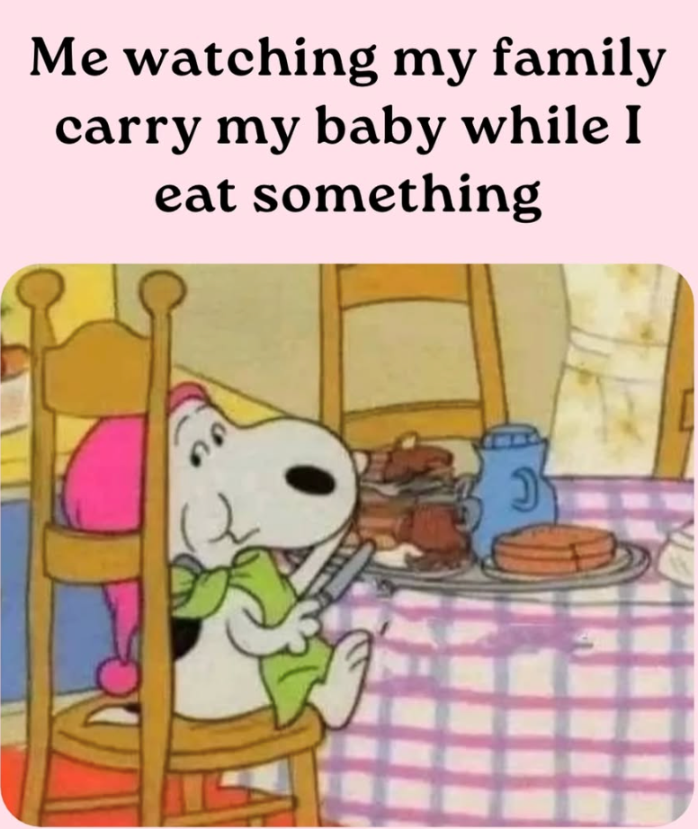 Me watching my family carry my baby while I eat something