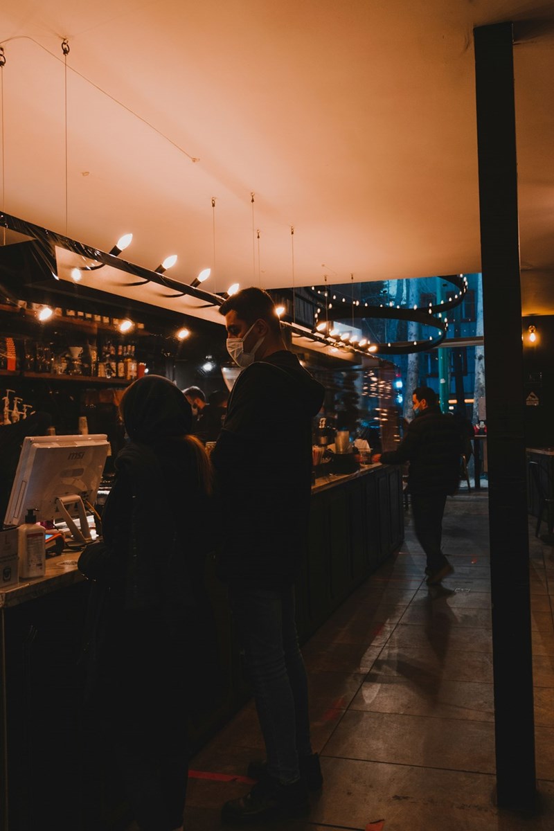 Two people doing the line in a coffee shop.
