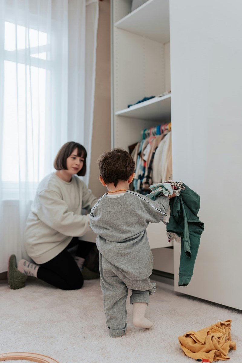 A woman babysits her nephew while he makes a mess in her apartment.