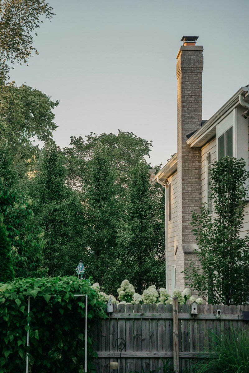 Low backyard fence separating two neighboring yards.