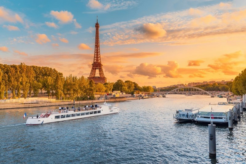Boat tour through France to see the Eiffel Tower.