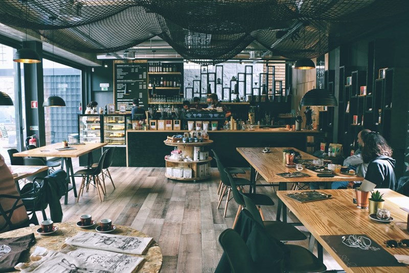 A busy cafe where customers await their order.