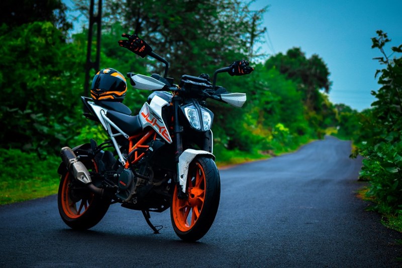 Motorcycle sits along the road.