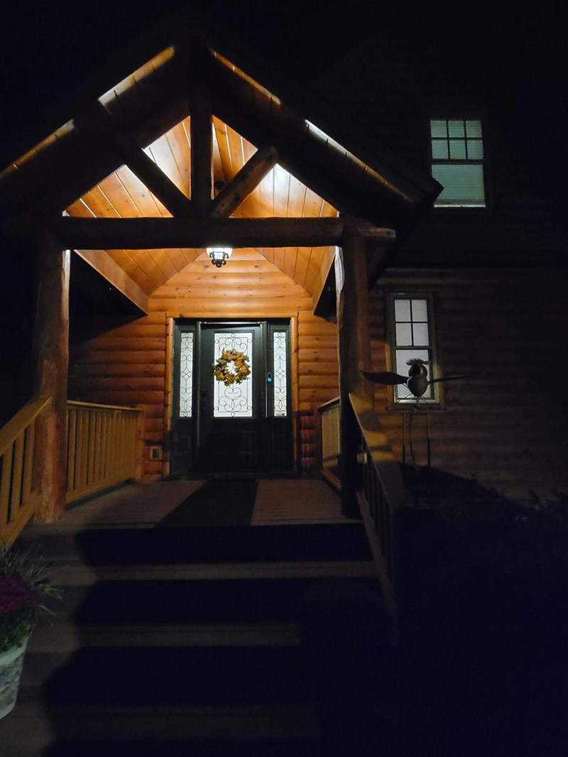 Cozy home with brightly lit porch.