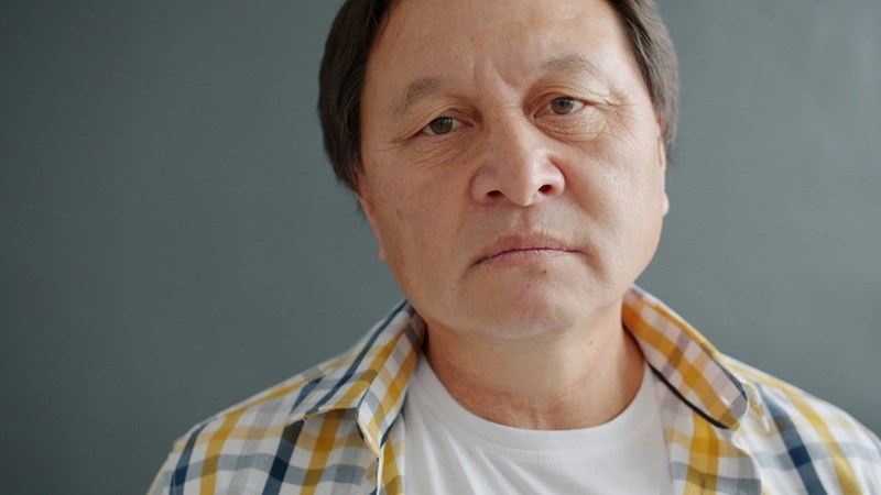 Close-up of an older Asian man's face