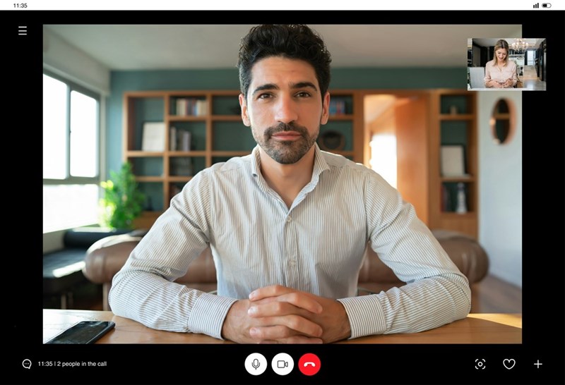 A young professional sits on a Zoom call with a human resources representative on the other end.