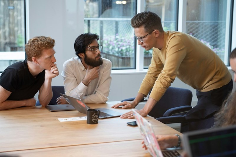 A group of people sit in a conference room