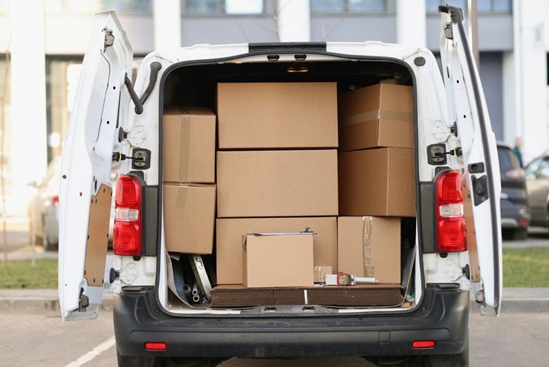 Van packed full of boxes.