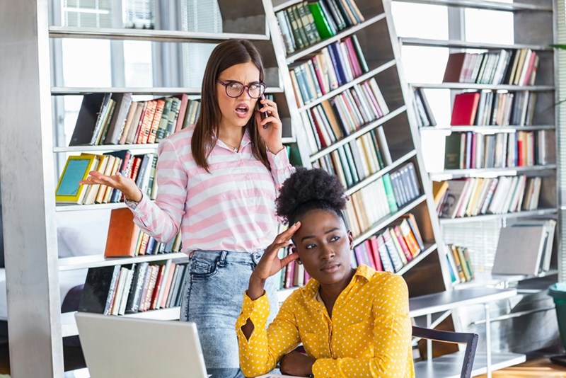 Bossy business woman and female employee