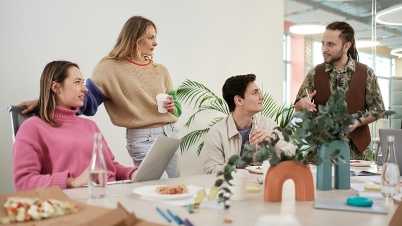 A group of people sitting around a table