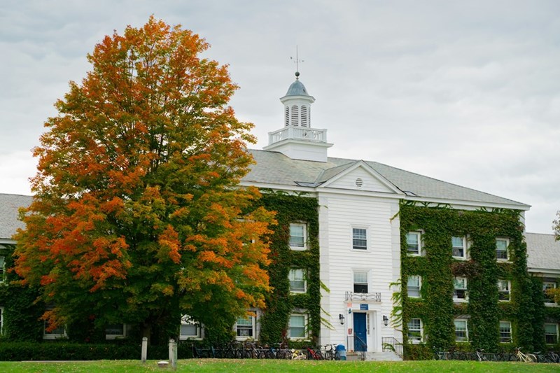 College dorm building during fall semester, capturing freshman campus life and student housing experiences.