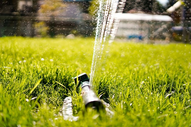 A garden sprinkler that needs repairing.
